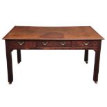 A GEORGE II MAHOGANY LIBRARY TABLE with tooled leather top above a central frieze drawer usable from