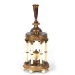 A 19TH CENTURY GILT ORMOLU AND IVORY CENTREPIECE with leaf cast trumpet surmount above a Rotunda