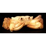 A JAPANESE MEIJI PERIOD IVORY SCULPTURE modelled as a crab with articulated eyes, inscribed