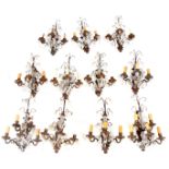A SET OF ELEVEN 20TH CENTURY BRASS AND CRYSTAL GLASS CUT ELECTRIFIED WALL LIGHTS with shaped backs