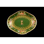 A BLOOR DERBY SHAPED OVAL SHALLOW DISH gilt edged and olive green ground with crested armorial