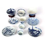 A COLLECTION OF 18TH - 19TH CENTURY CHINESE BLUE AND WHITE BOWLS AND CUPS of various sizes, two on