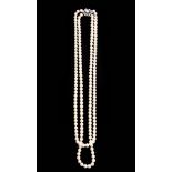 A BOODLE AND DUNTHORNE TWO-ROW PEARL NECKLACE the18ct white gold clasp set with diamonds surrounding