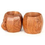 A PAIR OF ROBERT "MOUSEMAN" THOMPSON OAK NAPKIN RINGS of rounded octagonal form with carved mouse