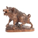 AN EARLY 20TH CENTURY CARVED BLACK FOREST SCULPTURE modelled as wild boar standing on a naturalistic