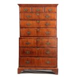 AN EARLY 18TH CENTURY FIGURED WALNUT CHEST ON CHEST with moulded cornice above three small and six