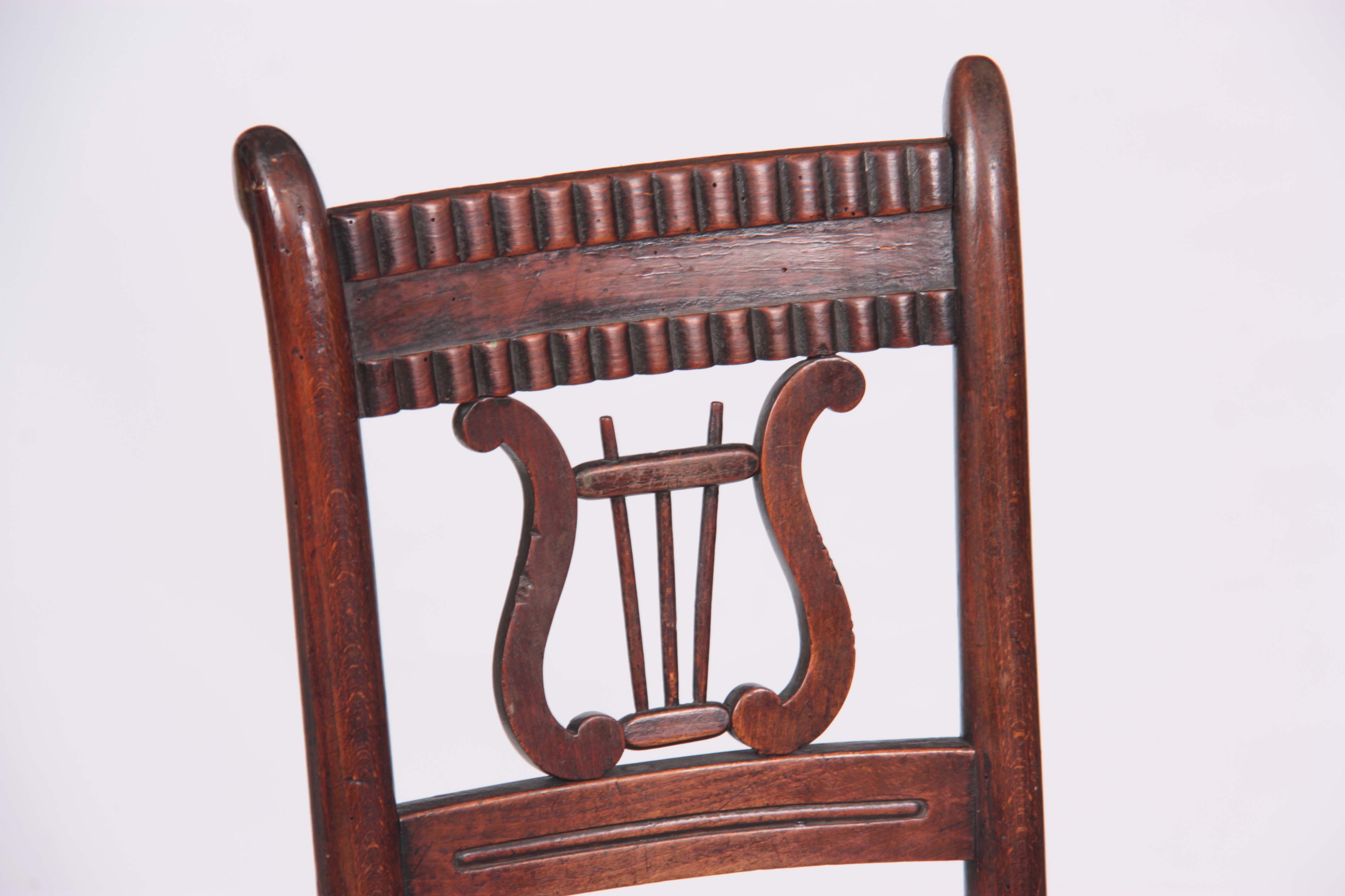 A 19TH CENTURY LATE REGENCY SIMULATED ROSEWOOD STAINED BEECH CHILD'S CORRECTION CHAIR with lyre- - Image 2 of 5