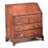 AN EARLY 18TH CENTURY SOLID BURR YEW WOOD BUREAU with hinged angled fall revealing a fitted interior