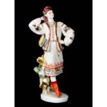 A MID 20th CENTURY RUSSIAN PORCELAIN FIGURE modelled as a lady dancer in traditional dress with