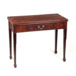 A GEORGE III FLAME MAHOGANY FOLD OVER TEA TABLE - PROBABLY WEST CUMBERLAND with cross-banded oval