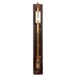 AN EARLY 20TH CENTURY LACQUERED BRASS SCIENTIFIC STICK BAROMETER with calibrated silvered dial and