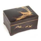 A JAPANESE MEIJI PERIOD MIXED METAL BRONZE BOX having a stag to the lid and birds to the front -