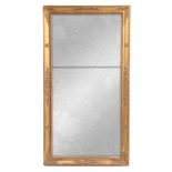 A 19th CENTURY REGENCY STYLE GILT GESSO RECTANGULAR MIRROR with stylised relief moulded frame