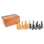 AN ASSORTED SET OF WOODEN CHESS PIECE SPARES in a wood chess piece box with sliding lid 24.5cm
