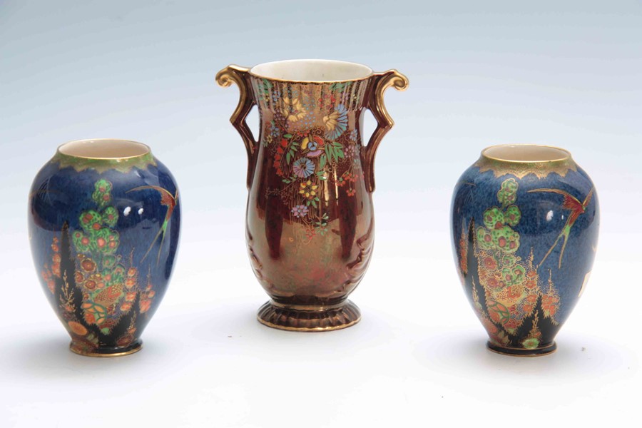 A PAIR OF CROWN DEVON FANTAZIA OVOID VASES decorated in vibrant leafing flower sprays and birds on a - Image 2 of 7