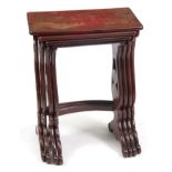 A SET OF 19TH CENTURY SCARLET LACQUER CHINOISERIE DECORATED NEST OF TABLES comprising four graduated