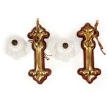 A PAIR OF EARLY 20TH CENTURY BRASS BENSON STYLE ART NOUVEAU WALL LIGHTS of scrollwork design with