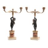 A FINE PAIR OF REGENCY BRONZE AND ORMOLU TWO BRANCH CANDELABRA having stylised shaped branch work