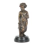 A 19TH CENTURY FRENCH BRONZE SCULPTURE OF A CHERUB mounted on a circular black slate base 28cm high.