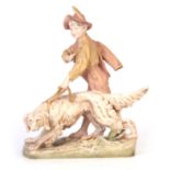 A 19TH CENTURY ROYAL DUX BOHEMIA LARGE FIGURE GROUP modelled as a boy walking a red setter dog on