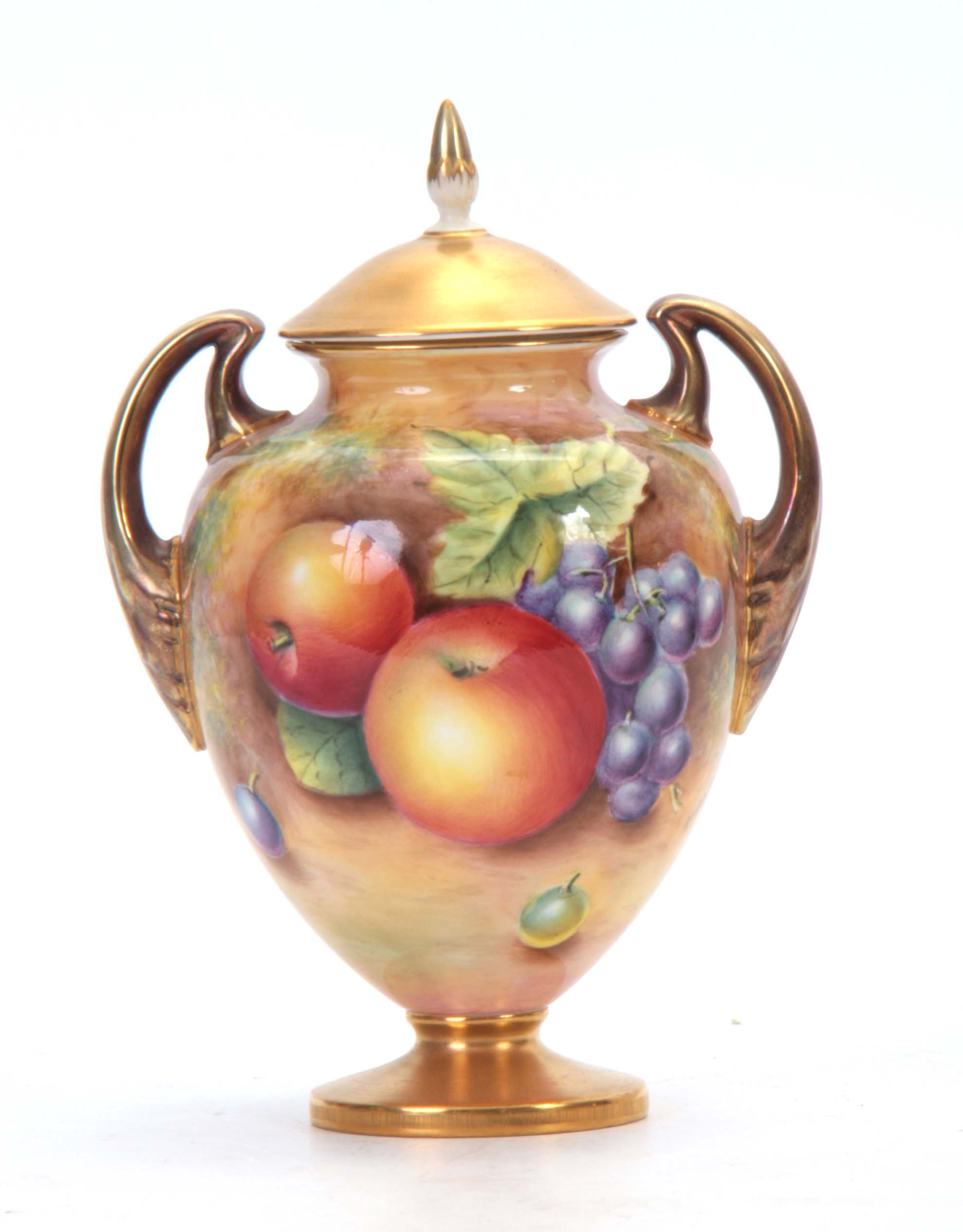 LEAMAN. A ROYAL WORCESTER GILT TWO-HANDLED PEDESTAL VASE AND COVER the ovoid body painted all