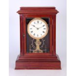 EUREKA CLOCK CO. LTD. LONDON AN EARLY 20TH CENTURY ENGLISH MAHOGANY ELECTRIC MANTEL CLOCK the