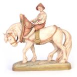 A ROYAL DUX BOHEMIA EQUESTRIAN FIGURE modelled as a workhorse and boy rider coloured in soft