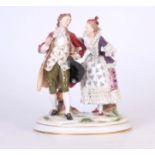 A LARGE NAPLES STANDING FIGURE GROUP depicting lovers dressed in fine classical coloured costume