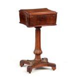 AN EARLY VICTORIAN ROSEWOOD TEAPOY of scalloped rectangular form with divided interior on a fluted
