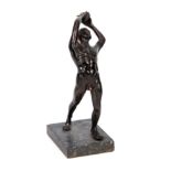 A 20TH CENTURY BRONZE FIGURE OF A DISCUS THROWER mounted on a veined marble base 23cm high.