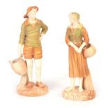 A PAIR OF WORCESTER SHOT ENAMELS STANDING FIGURES MODELLED AS A FRENCH FISHER BOY AND GIRL each