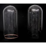 TWO 19TH CENTURY CYLINDRICAL GLASS DOMES 45cm high.