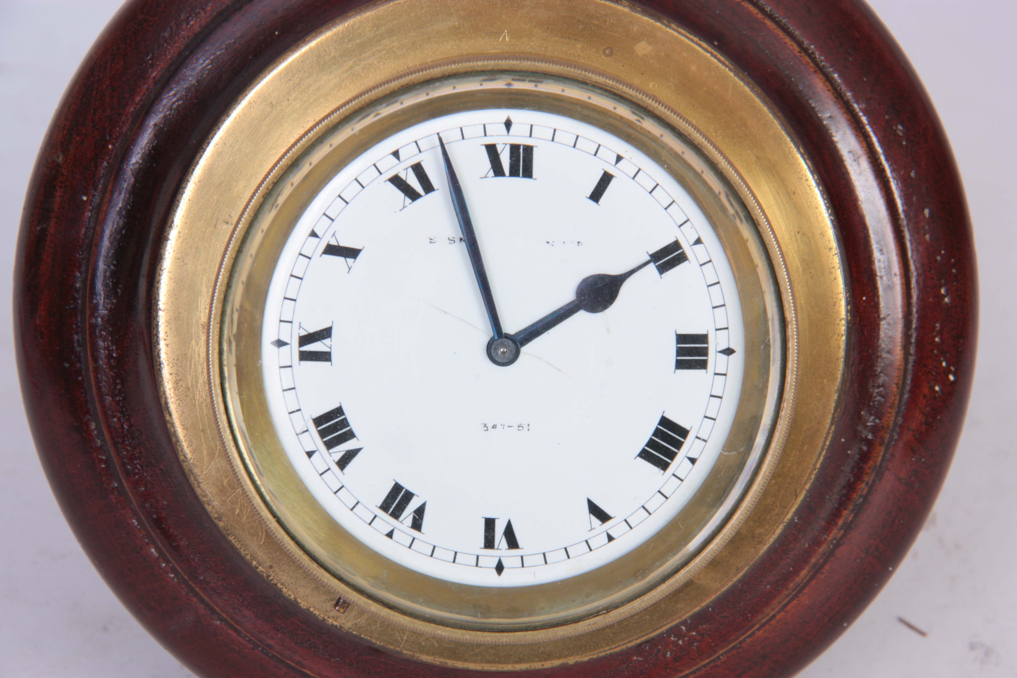 AN EARLY 20TH CENTURY CAR CLOCK having a brass case with bayonet fitted dashboard mount, the white - Image 2 of 4