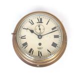 AN EARLY 20TH CENTURY ENGLISH SHIPS CLOCK with brass drum-shaped case enclosing a 6" painted dial
