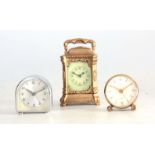 A COLLECTION OF THREE CASED TRAVELLING CLOCKS comprising a small carriage clock signed N.H.C & Co. A