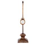 A LARGE GRAVITY SAW CLOCK the tapering moulded square marble base supporting a toothed brass