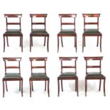 A SET OF EIGHT REGENCY SOLID ROSEWOOD SABRE-LEG DINING CHAIRS with bar backs and drop-in seats