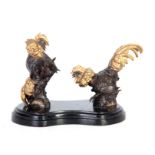 AFTER MENE, A 20TH CENTURY GILT HIGHLIGHTED BRONZE SCULPTURE OF TWO FIGHTING COCKERALS mounted on