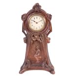 A FRENCH COPPERED METAL ART NOUVEAU STYLE MANTEL CLOCK the floral design case enclosing a 3.25"