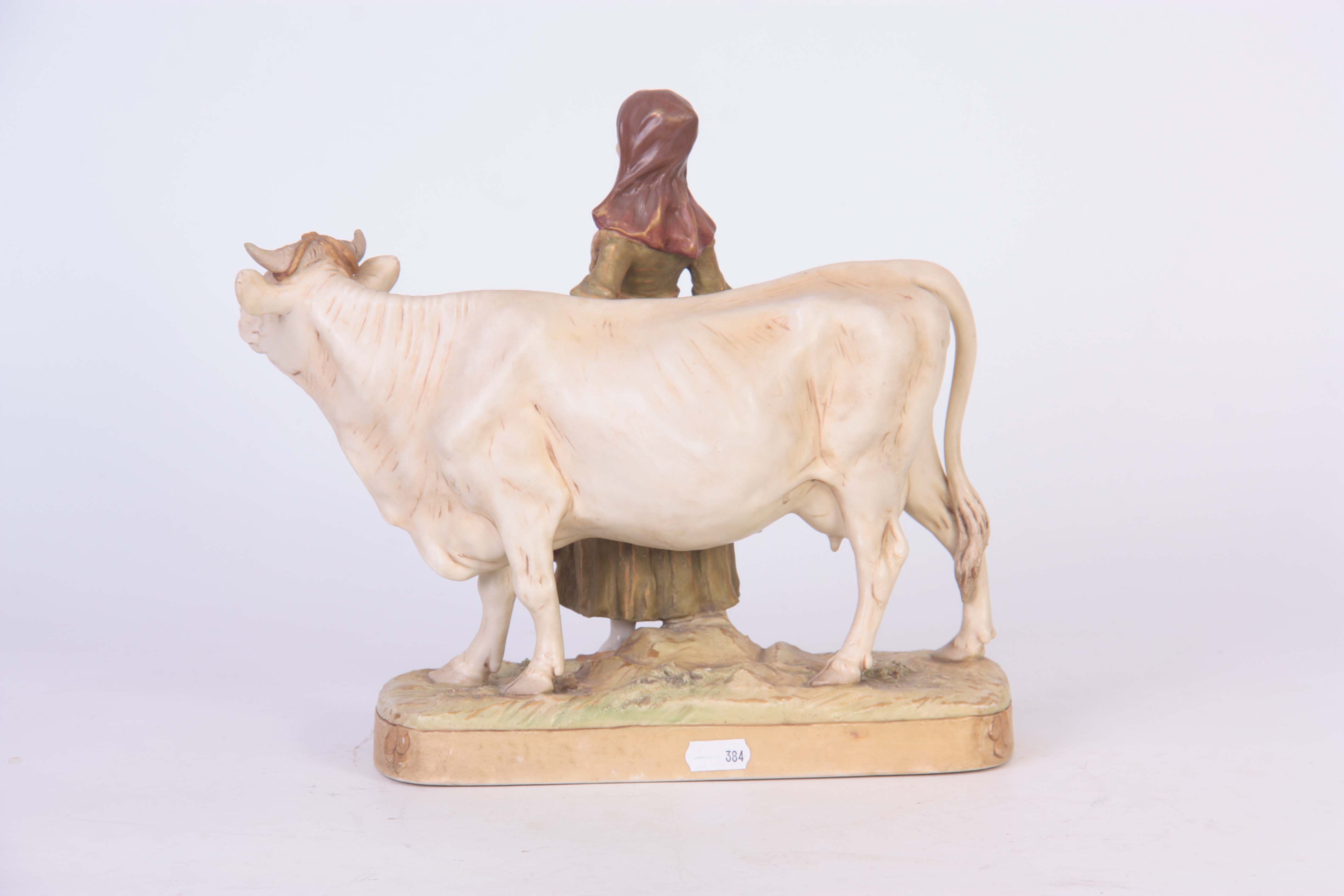 A ROYAL DUX BOHEMIA ANIMAL FIGURE modelled as a dairy cow and standing milk maid coloured in soft - Image 6 of 7