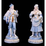 A PAIR OF 19TH CENTURY GERMAN BISCUIT PORCELAIN GILT ANS PALE BLUE GROUND STANDING CLASSICAL MALE