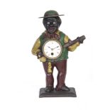 A 20TH CENTURY CAST IRON NOVELTY AUTOMATION CLOCK modelled as a banjo player with enamel Roman