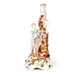A 19TH CENTURY DRESDEN PORCELAIN CANDLESTICK of elaborate florally encrusted design as a tree