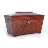A 19TH CENTURY FLAME MAHOGANY SARCOPHAGUS SHAPED TEA CADDY with angled moulded hinged lid