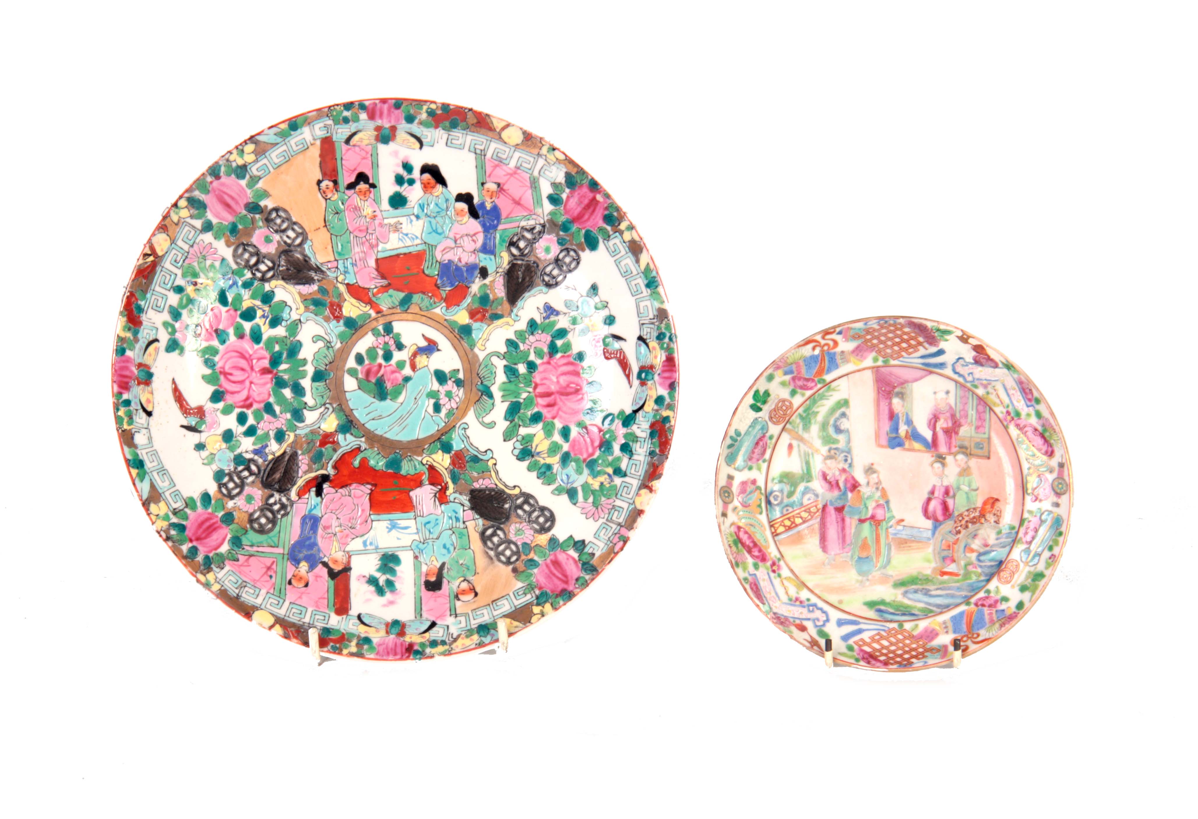 TWO 20TH CENTURY CANTON CHINESE PLATES with figures and floral decoration 26cm and 16cm diameter.