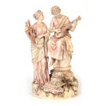 A LATE 19TH CENTURY ROYAL DUX BOHEMIA GLAZED CLASSICAL FIGURE GROUP depicting a pair of maidens