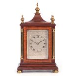 B. MALLINSON & Co. HUDDERSFIELD. AN EARLY 20TH CENTURY MAHOGANY CASED STRIKING MANTEL CLOCK OF SMALL