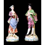 A PAIR OF 19TH CENTURY CHELSEA DERBY STYLE STANDING FIGURES finely modelled and dressed in classical