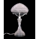 A 20THCENTURY ELECTRIFIED CRYSTAL CUT GLASS TABLE LAMP with pedestal stem and mushroom shade 43cm