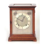 AN EARLY 20TH CENTURY MAHOGANY QUARTER CHIMING BRACKET CLOCK inset with five glass panels